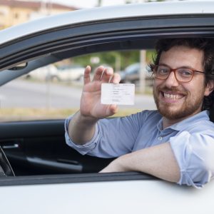 Driving school student with drivers license